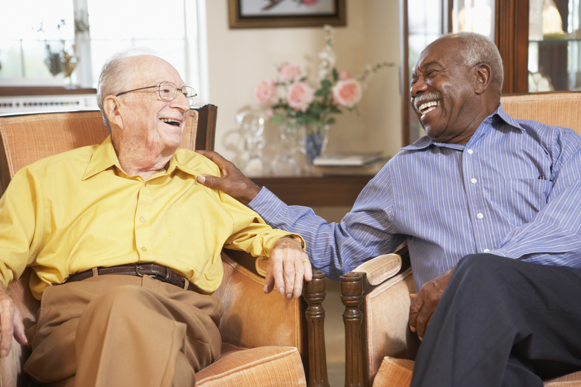 two men sitting and talking